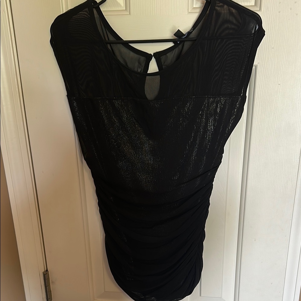 bebe Shimmery Black Top with mesh detailing and loop snap back